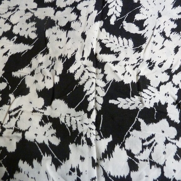 Fabric with white flower and fern patternon a black background - Picture 1 of 3